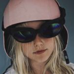 Outdoor Adventure Girl With Helmet And Goggles