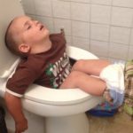 Boy Sleeping In Toilet