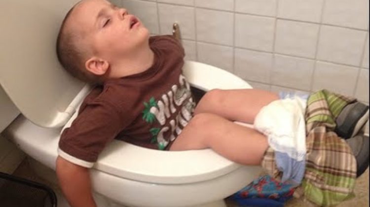 Boy Sleeping In Toilet