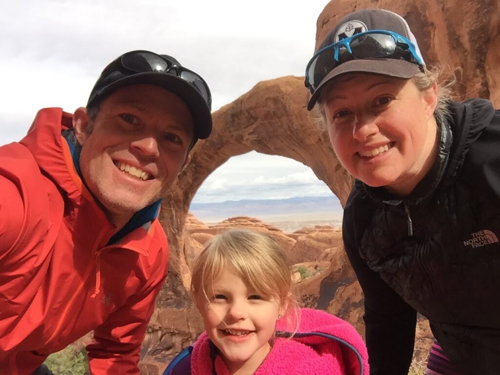 Happy family posing at Arches National Park